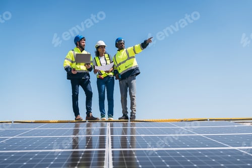 Preview: Service engineer checking solar cell on the roof. Clean energy concept.