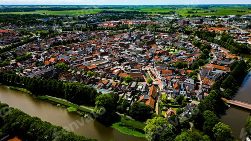 Preview: Aerial shot of the beautiful Dokkum city surrounded by a river during daytime
