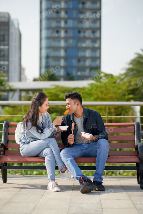 Preview: Woman Sharing Corn Dog with Boyfriend