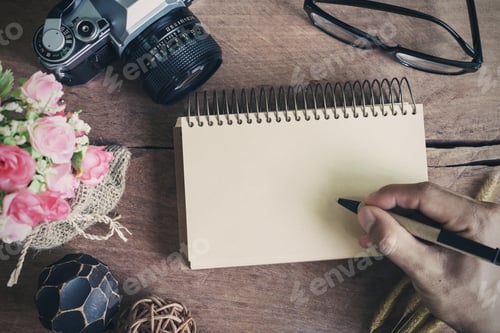 Preview: Retro camera with blank notebook on old wooden table