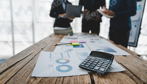 Preview: Young colleagues discuss business brainstorming and price charts analyze business people at the desk