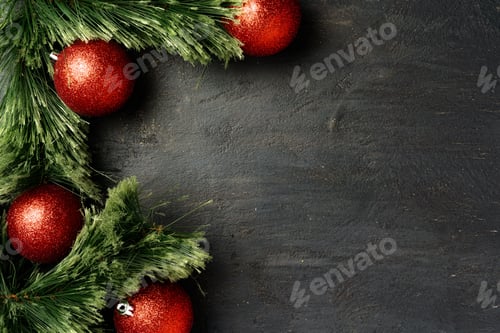 Preview: Christmas background with fir tree branches and red baubles on black