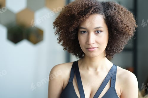 Preview: Close up portrait of cute stylish African American woman with beautiful face. Elegant fashion model.