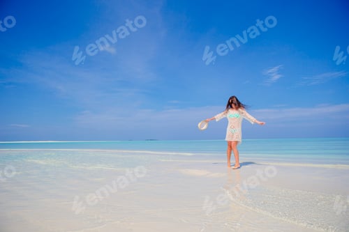 Preview: Young woman enjoy tropical beach vacation on Maldives