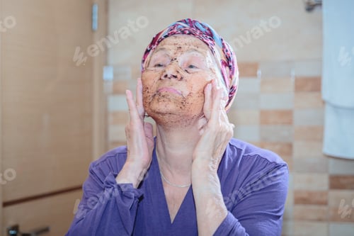 Preview: Elderly woman taking care of her face
