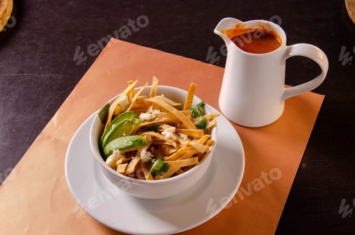 Preview: Soup Mexican Food Cenital served with a red sauce on the table