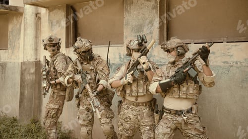 Preview: Professional marine soldiers training with weapon on a military range.
