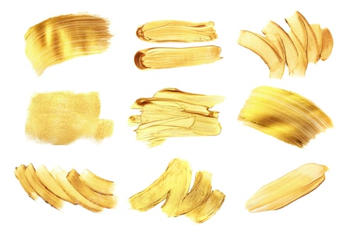 Preview: Set of golden paint strokes, isolated on white.