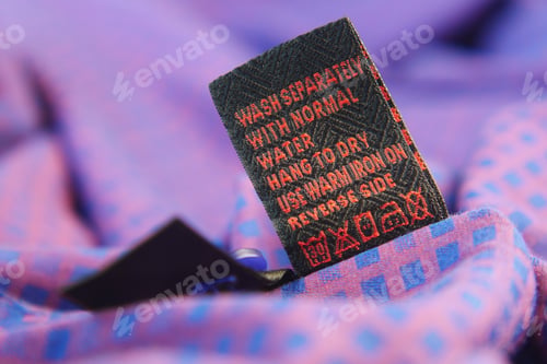 Preview: Clothing label with care symbols on a cloth