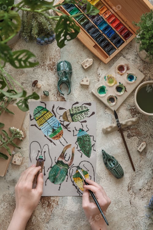 Preview: Top view of watercolor with homemade different bugs and ceramic decorative houses and bugs