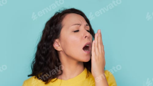 Preview: Health Care: Woman checking her breath with hand. Closeup portrait headshot sleepy