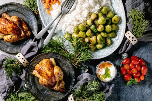 Preview: Christmas dinner table with grilled chicken, rice and vegetables