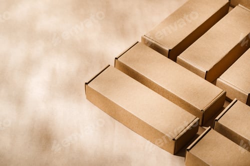 Preview: Brown cardboard boxes arranged on a neutral background in a warehouse setting during daylight hours