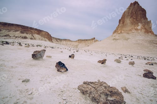 Preview: Sandy desert covered with stones and rocks