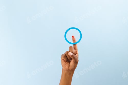Preview: Hand of biracial man with blue ring over bleeding finger, on blue background with copy space