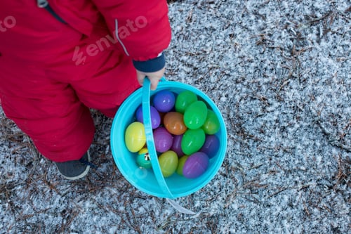 Preview: Boy with bucket of toy eggs