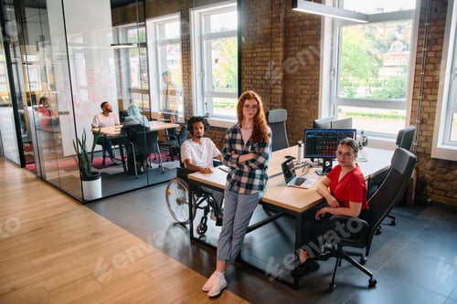 Preview: A diverse group of business professionals collaborates in a modern startup coworking center