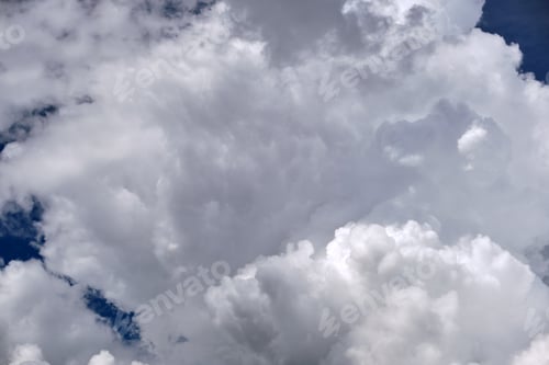 Preview: Bright landscape of white puffy cumulus clouds on blue clear sky