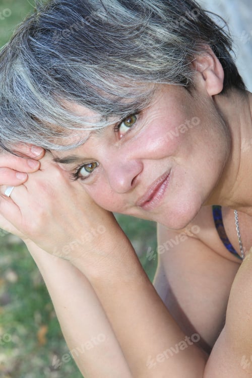 Preview: Portrait of Smiling Mature Woman Outdoors