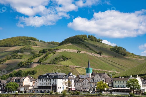 Preview: Village nestled beside a hill with a slope alongside, Rhine, Germany