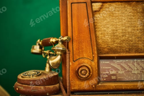 Preview: Vintage telephone, old retro radio on wood table