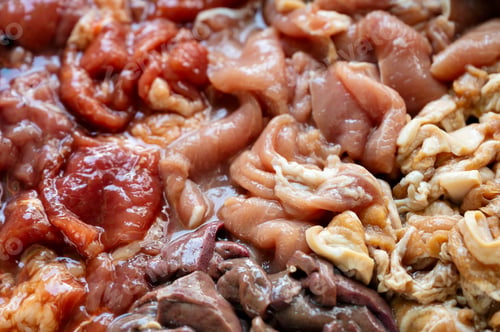 Preview: Various parts of raw sliced pork with marinated pork, pork belly, pork liver in stall