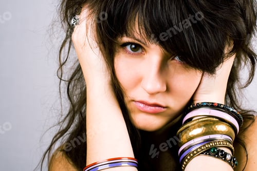 Preview: young brunette lady with bracelets