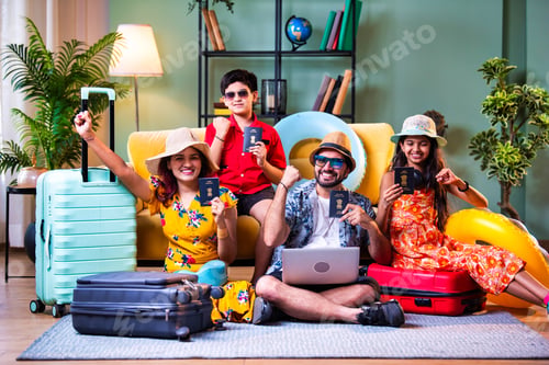Preview: Young Indian parents and kids with laptop, suitcases, and passports for a vacation