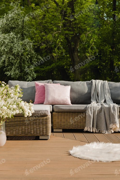 Preview: Beautiful green garden with wicker terrace furniture and trees