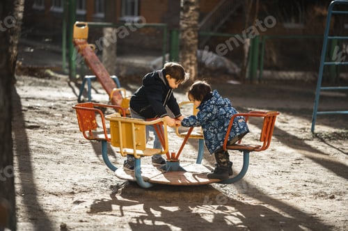 Preview: Two boys are walking on the playground