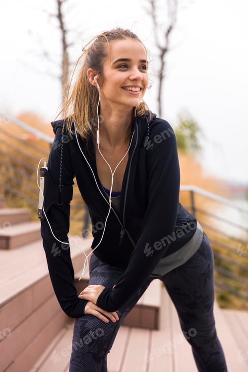 Preview: Portrait of a young woman resting after run