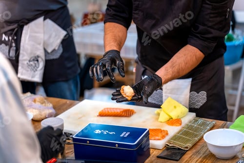 Preview: Sushi cooking workshop. Master sushi chef preparing a nigiri.