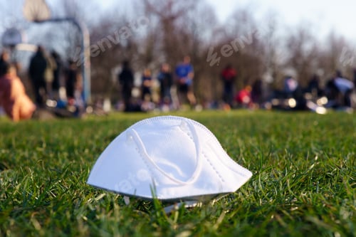 Preview: Corona mask in park with people in background