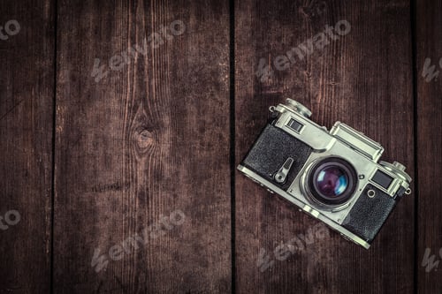 Preview: Old retro vintage camera on grunge wooden background