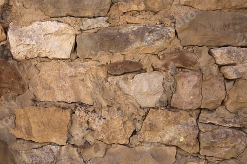 Preview: Masonry walls of natural sand color. Stone texture close-up, construction and mining background.