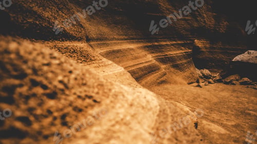 Preview: Textured sandstone canyon with layered rock formations.