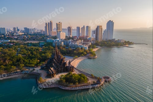 Preview: Sanctuary of Truth, Pattaya, Thailand, wooden temple by the ocean at sunset on the beach of Pattaya