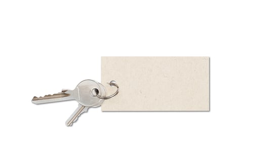 Preview: Close up shot of keys and an empty tag on a white background
