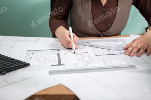 Preview: Details shot of architect blueprints on a desk