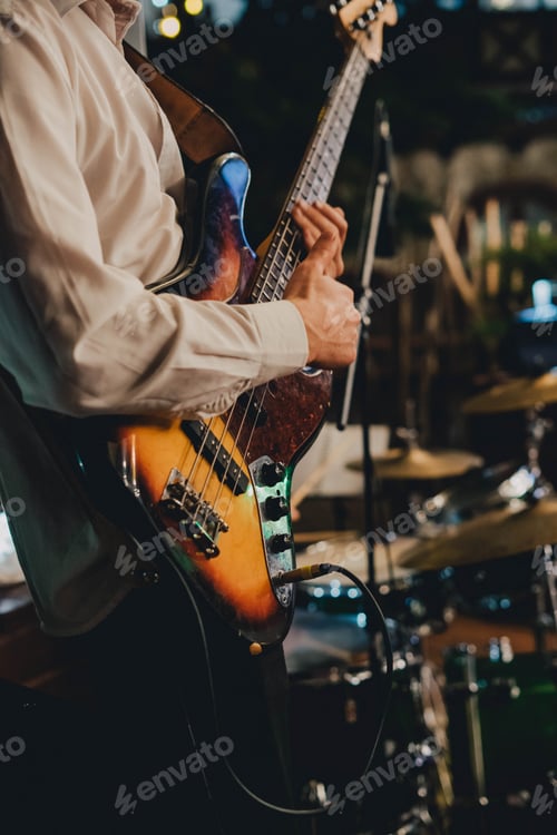 Preview: Musician Plays Electric Bass Guitar At Night