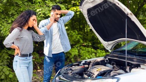 Preview: Young arab man calling for help on phone, car break