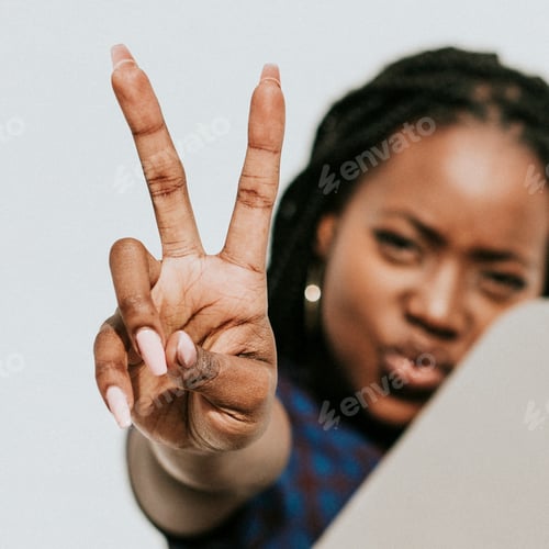 Preview: Black woman showing a v sign