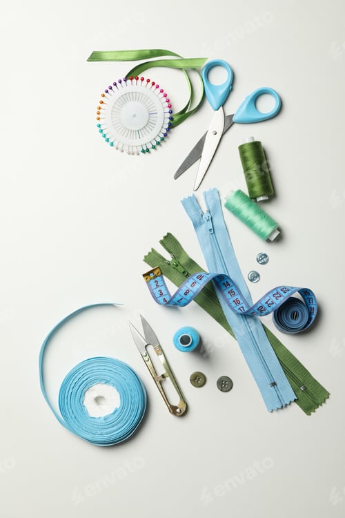 Preview: Sewing supplies on white background, top view