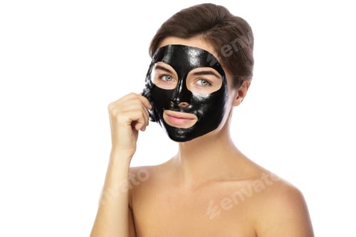 Preview: Woman Removing Black Facial Mask for Skin Care