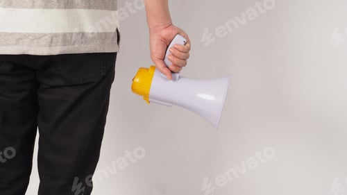 Preview: The hand is holding a megaphone on white background. The hand attachment body turn around
