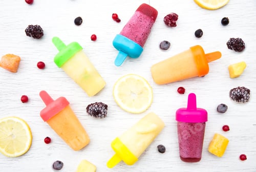 Preview: Flat Lay food background of fruity ice lollies with fruit ingredients berries lemons and fresh mango