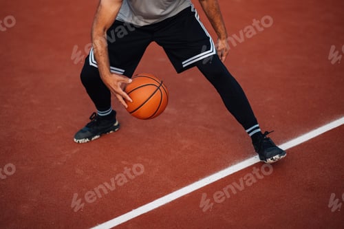 Preview: Basketball being dribbled on court line