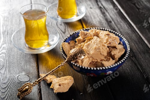 Preview: Tasty halva with tea on the table. Close up