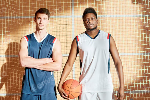 Preview: Serious athletic handsome basketball competitors ready for game