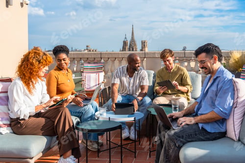Preview: Diverse team brainstorming on a modern rooftop terrace